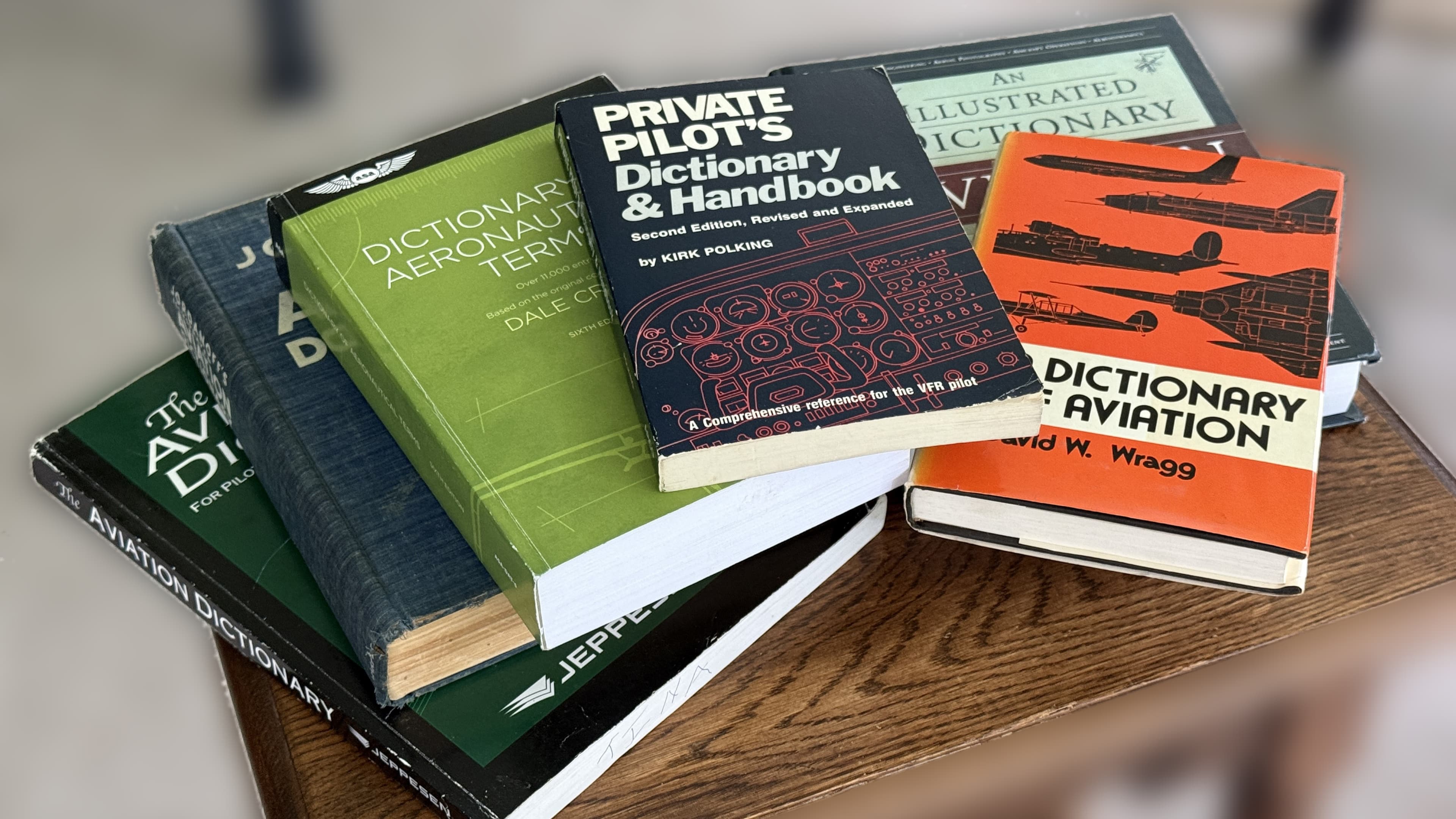 A stack of well-worn aviation dictionaries